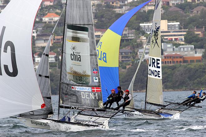 Tight racing between Original Chia and Pure Blonde on the first spinnaker run - JJ Giltinan Championship 2014 © Australian 18 Footers League http://www.18footers.com.au